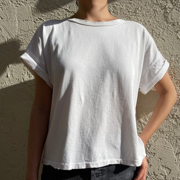 Classic White Distressed Tee Shirt by Le Bon Shoppe on a Model at Golden Rule Gallery in Excelsior, MN