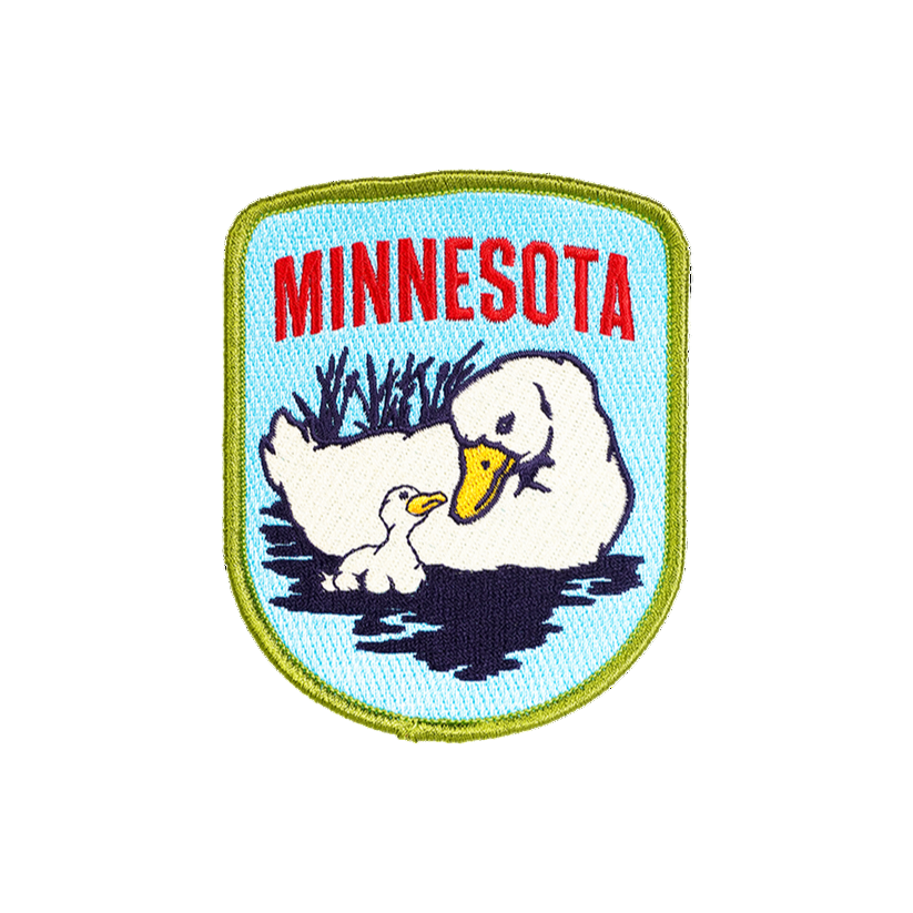 Embroidered patch with ducks and 'Minnesota' text on a light blue background