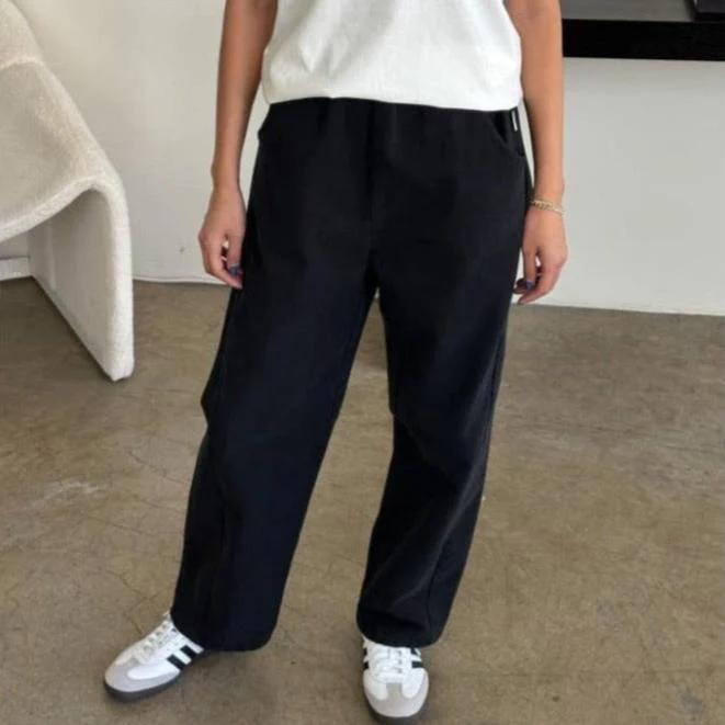 Model in Relaxed Black Canvas Pants