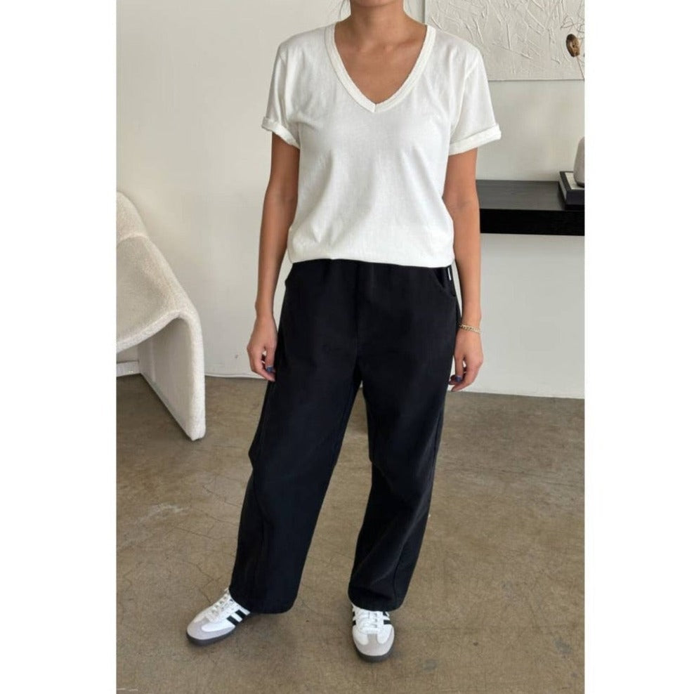 Model in Relaxed Black Canvas Pants