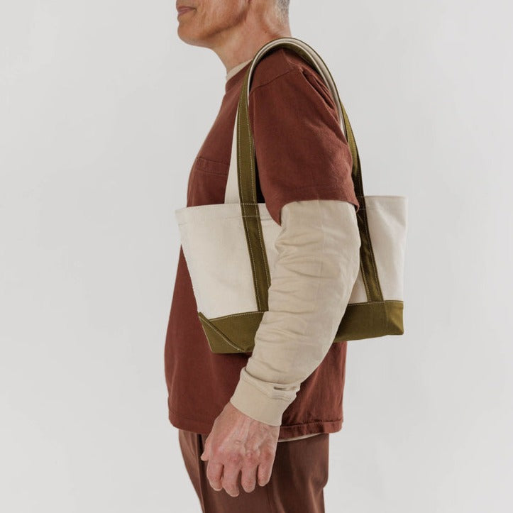 Model Carrying The Baggu Heavyweight Canvas Boat Tote In Size Small