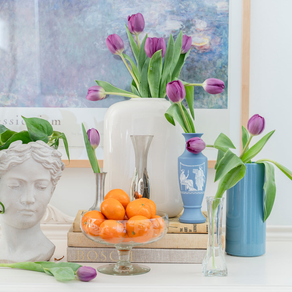 Purple tulip display with vintage glass vase