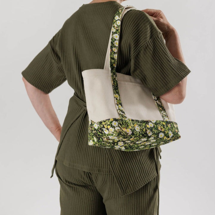 Model With The Small Canvas Boat Tote In Daisy pattern 
