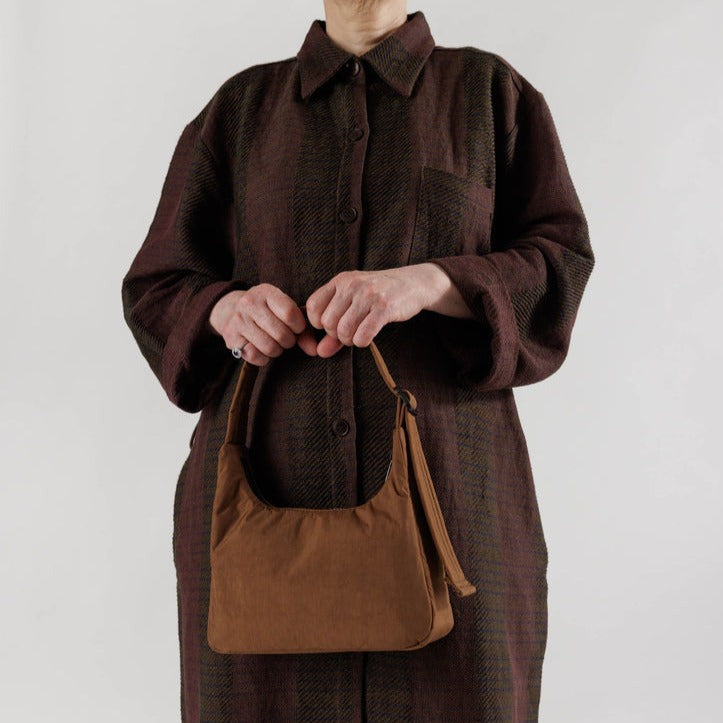 Model Holding Brown Baggu Mini Nylon Shoulder Bag
