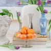 Assorted Vintage Vases Styled with a Vintage Etched Glass Bowl Full of Oranges and an Athena Bust Planter