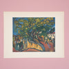 Print artwork of a stylized landscape with a large tree on a pink wall.