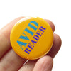 Avid Reader Social Alert Pinback Button at Golden Rule Gallery in Excelsior