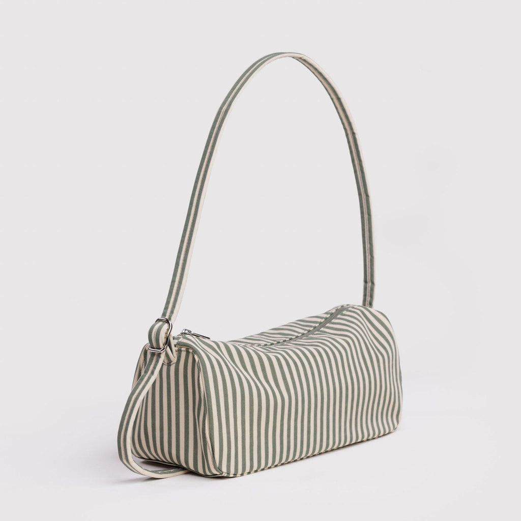 Striped handbag with a thin shoulder strap on a light gray background