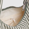 Close-up of a Baggu striped bag with zippers on a white background