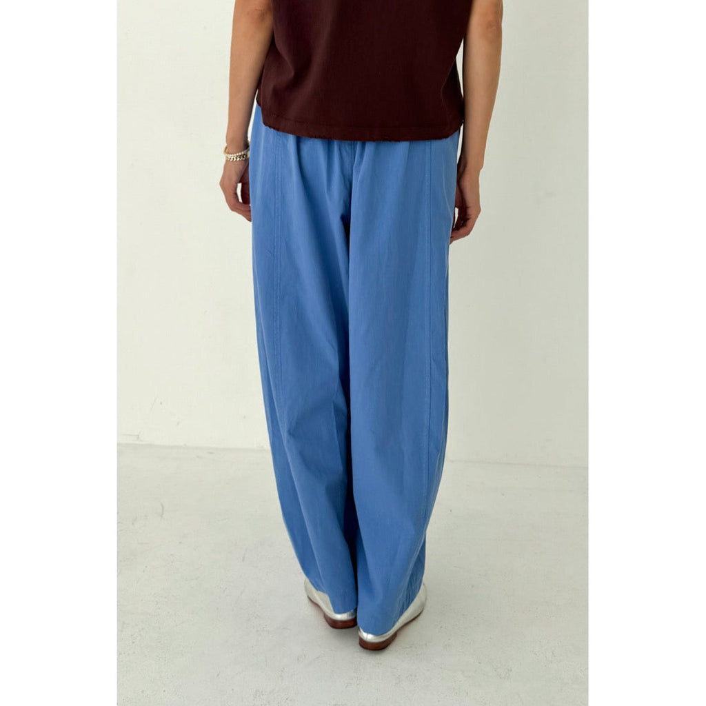 Model in Balloon Parachute Pants in Bright Blue