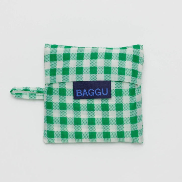 Baggu Baby Reusable Tote Bag in Green Gingham Folded in Pouch at Golden Rule Gallery