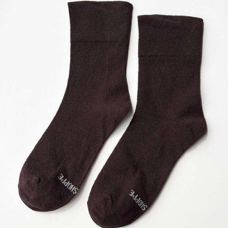 Pair of brown "Dark Cacao" socks on a white background
