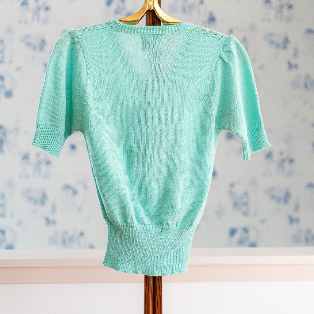 Back of 70s Knit Turquoise Top