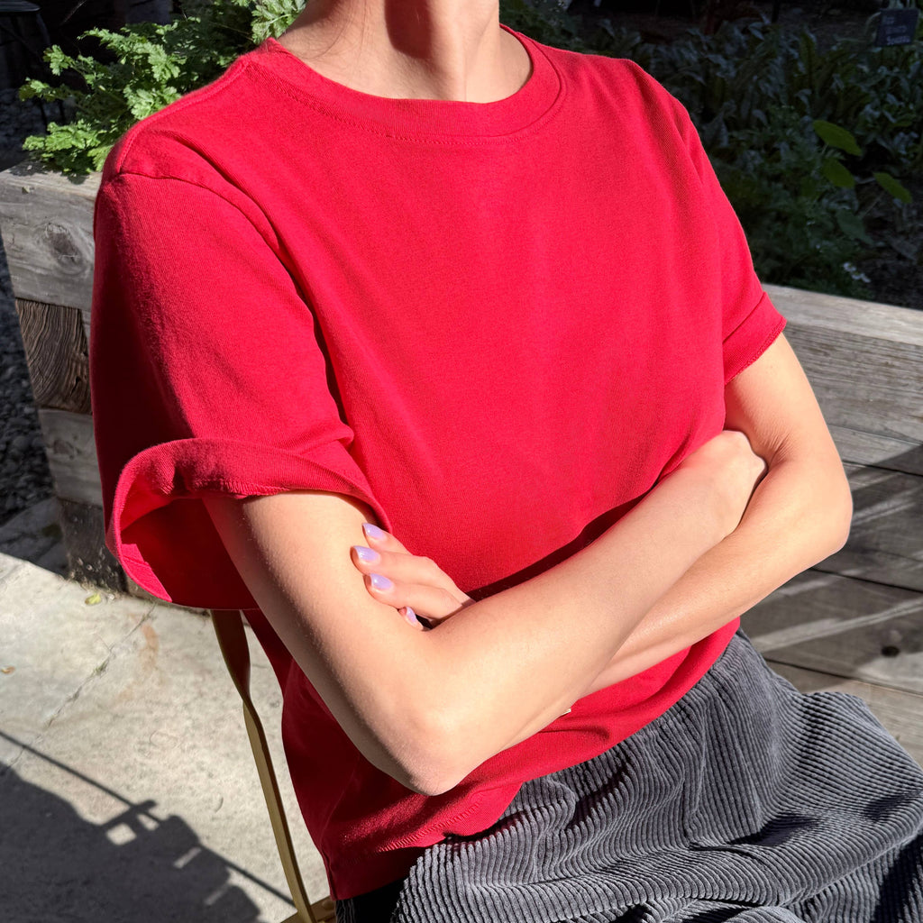Person wearing chili red noel tee by le bon shoppe