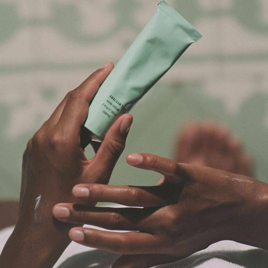 Non-greasy scented hand lotion being applies to hands