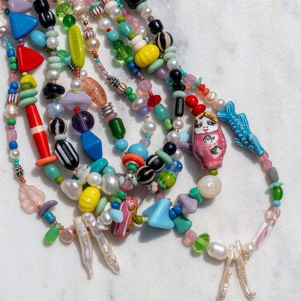 Assortment of Colorful Collected Beads and Pearl Necklaces