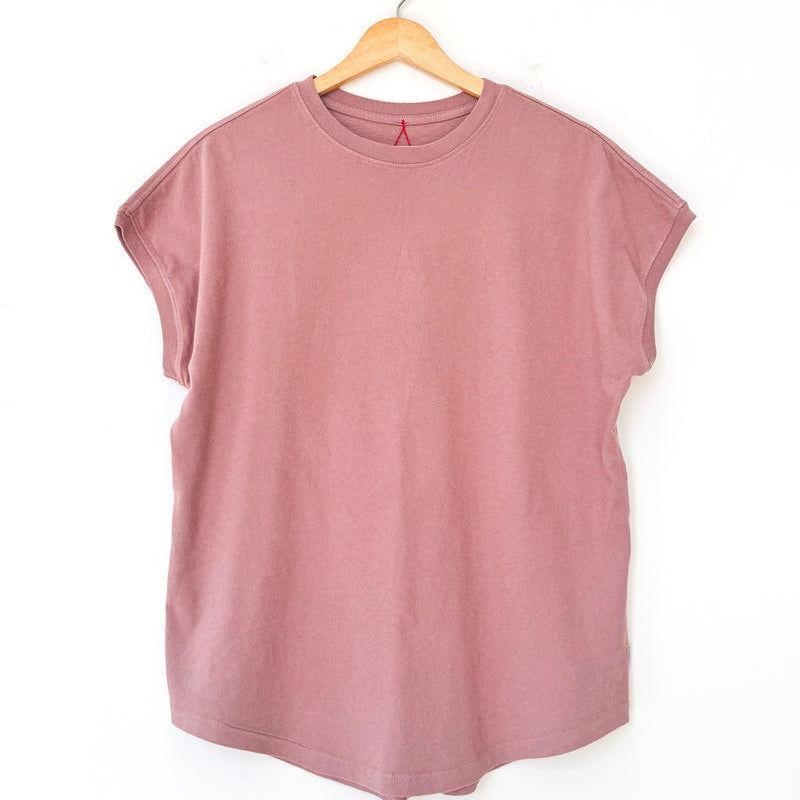 Mauve sleeveless top by Le Bon Shoppe on a wooden hanger against a white background