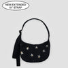 Extended Strap of Baggu Small Nylon Crescent Bag With Star Designs at Golden Rule Gallery