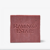 A rectangular bar of dusty rose soap with 'FLAMINGO ESTATE' embossed on the front, centered against a clean white background.
