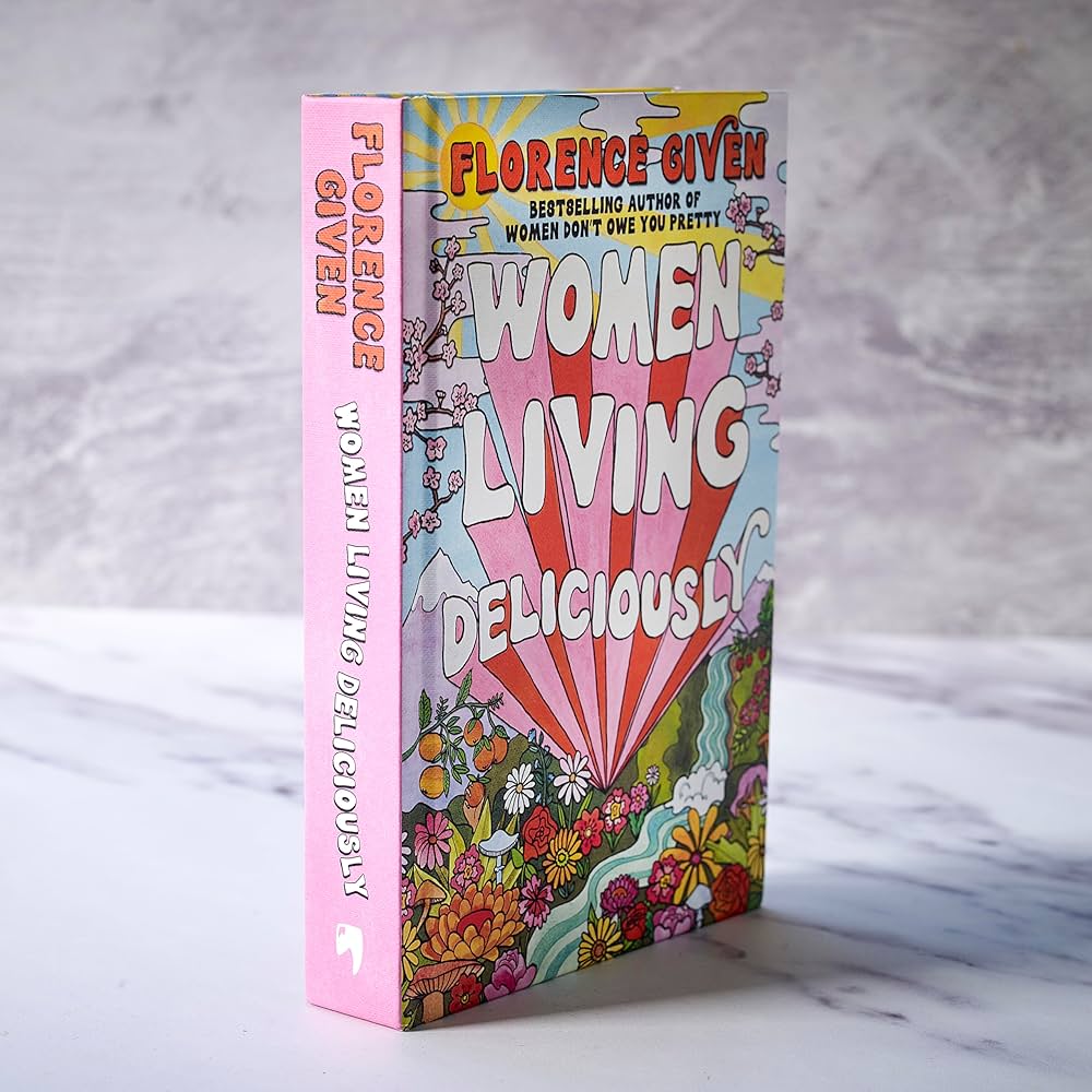 Book titled 'Women Living Deliciously' by Florence Given on a marble surface with a gray background