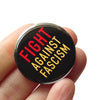 Fight Against Racism Social Alert Pinback Buttons by Word for Word at Golden Rule Gallery