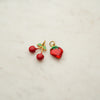 Two colorful fruit charms at Golden Rule Gallery