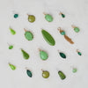 Collection of Green Jewelry Charms at Golden Rule Gallery