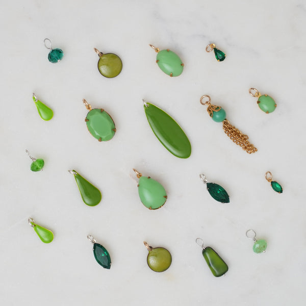 Collection of Green Jewelry Charms at Golden Rule Gallery