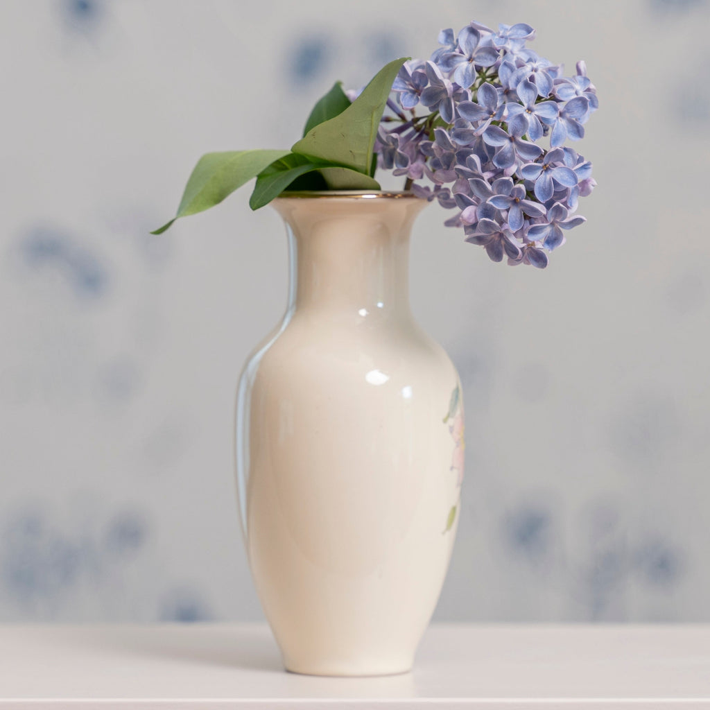 Glossy vintage vase with purple flowers