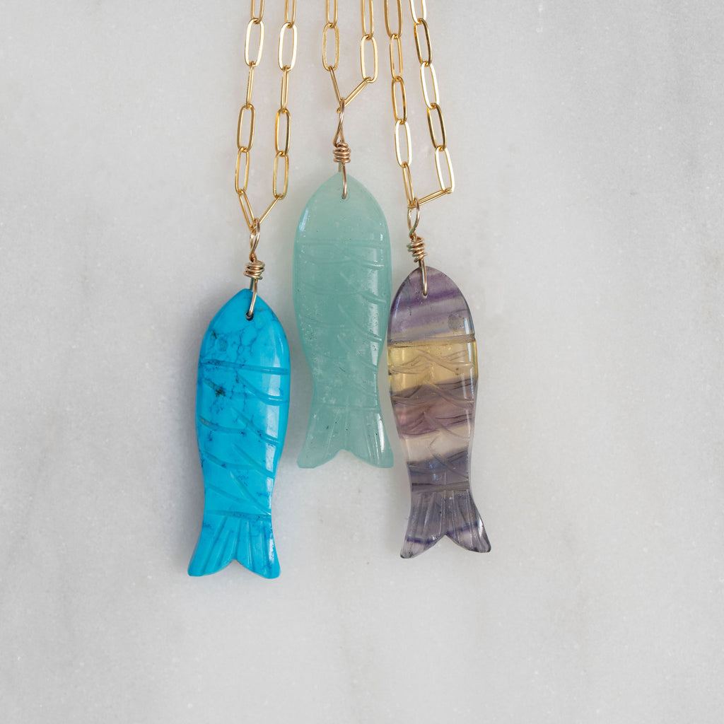 Three Fish Necklaces on Gold Chain Necklaces