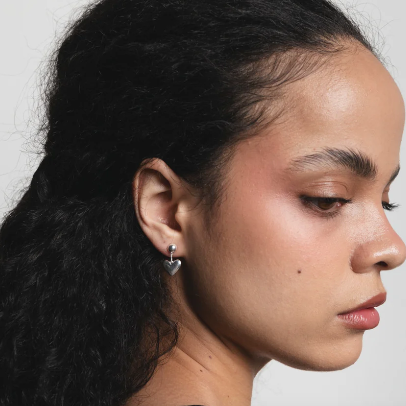 Wolf Circus Heart Silver Drop Earrings on Model