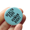 Health Care is a Human Right Social Alert Buttons at Golden Rule Gallery in Minneapolis