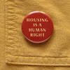 Housing is a Human Right Social Alert Buttons at Golden Rule Gallery