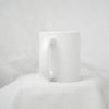White Ceramic Mug by Golden Rule Gallery