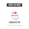 Pinback button with 'I ❤️ Immigrants' text on a white background