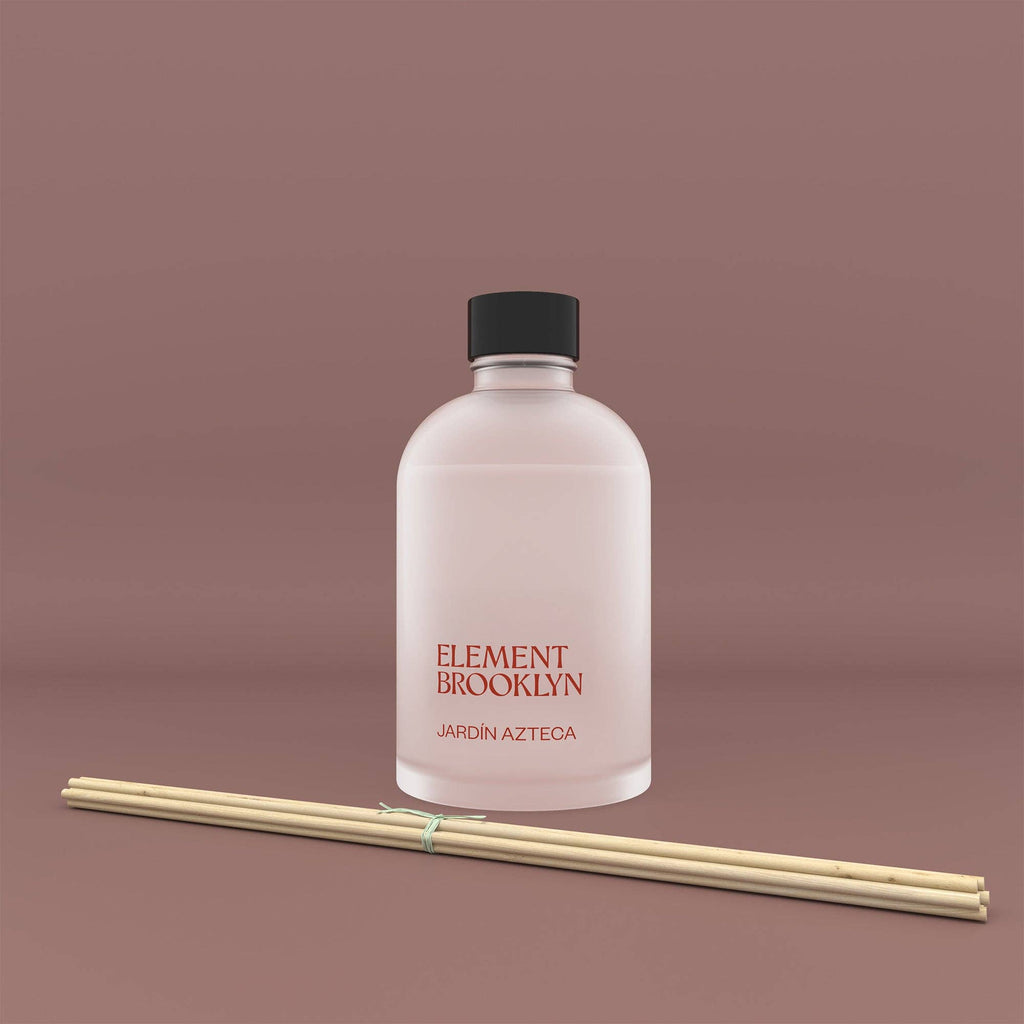 Element Brooklyn diffuser bottle with reeds on a brown background