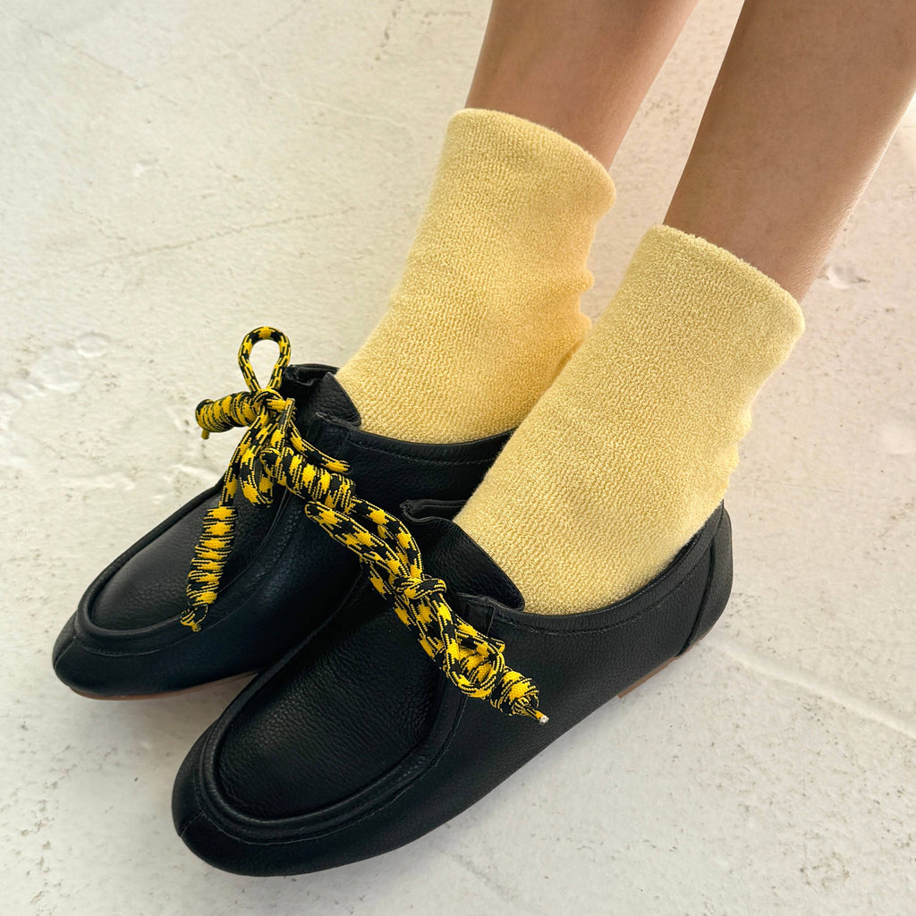 Le Bon Shoppe Cloud Socks in Lemon Water Yellow Styled with Black Shoes and Yellow Laces