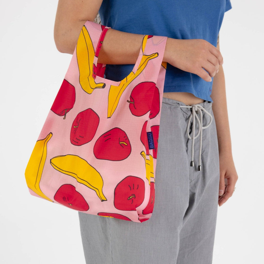 Light Pink Baggu Baby Reusable Tote Bag with Apples and Bananas at Golden Rule Gallery