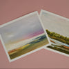 Two oil paintings of landscapes on a pink background