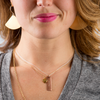 Model in Vintage Gold M Initial Charm Necklace