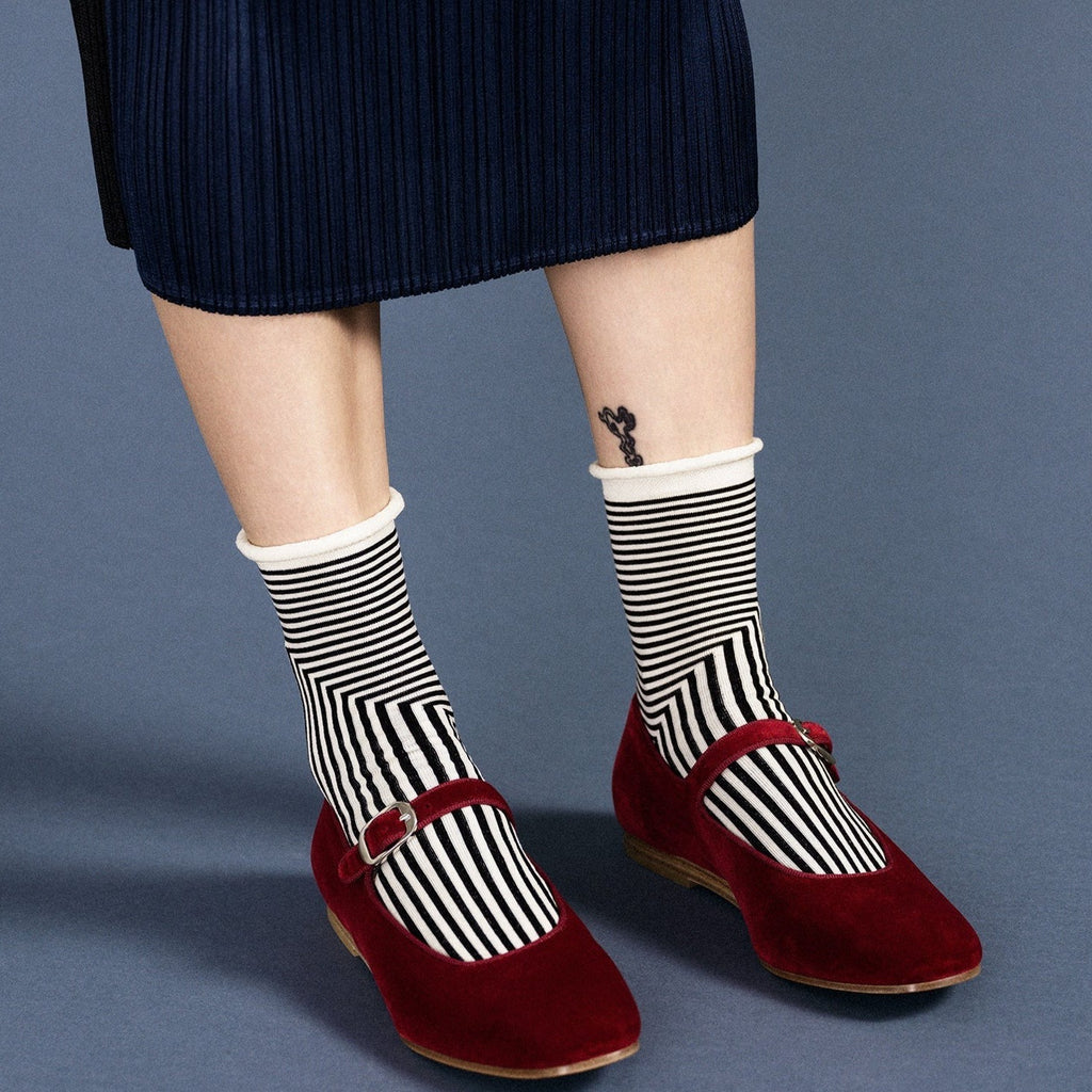 Model Wearing the Hansel from Basel Corbusier Crew Socks in Black Stripe at Golden Rule Gallery