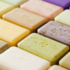 Close-up of various bars of soap with a Pre De Provence embossed.