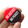 No Justice! No Peace! Political Protest Pinback Buttons at Golden Rule Gallery in Minneapolis
