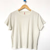 Chalk Noel Short Sleeve Tee Shirt on a Hanger by Le Bon Shoppe