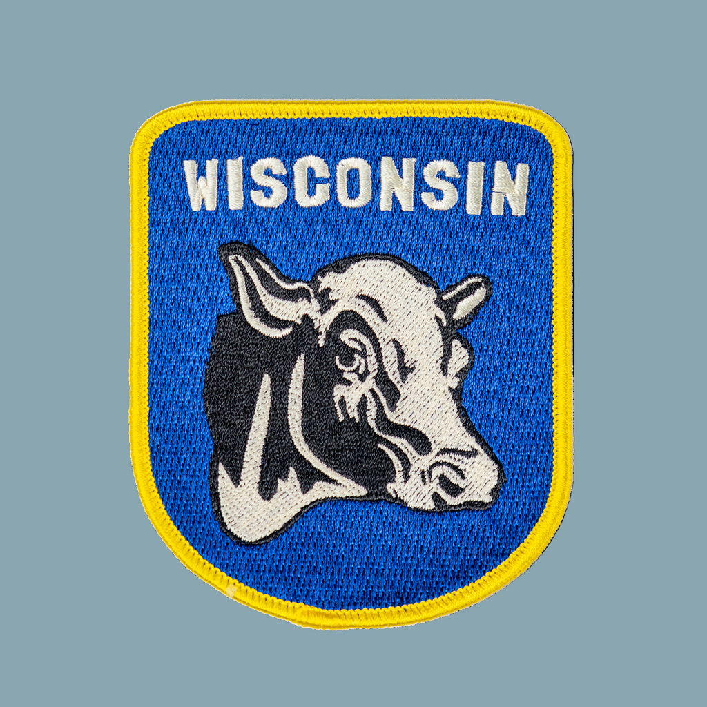 Patch with a cow head and 'Wisconsin' text on a blue background