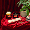 P.F. Candle HI-FI Collection Products on Red Fabric