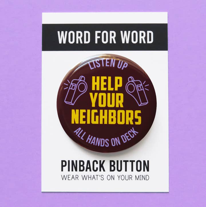 Pinback button with text 'Help Your Neighbors' on a purple background