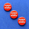 POWER TO THE PEOPLE Social Alert Pinback Buttons at Golden Rule Gallery