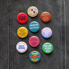 Political Protest Social Alert Buttons by Word for Word at Golden Rule Gallery in Minneapolis