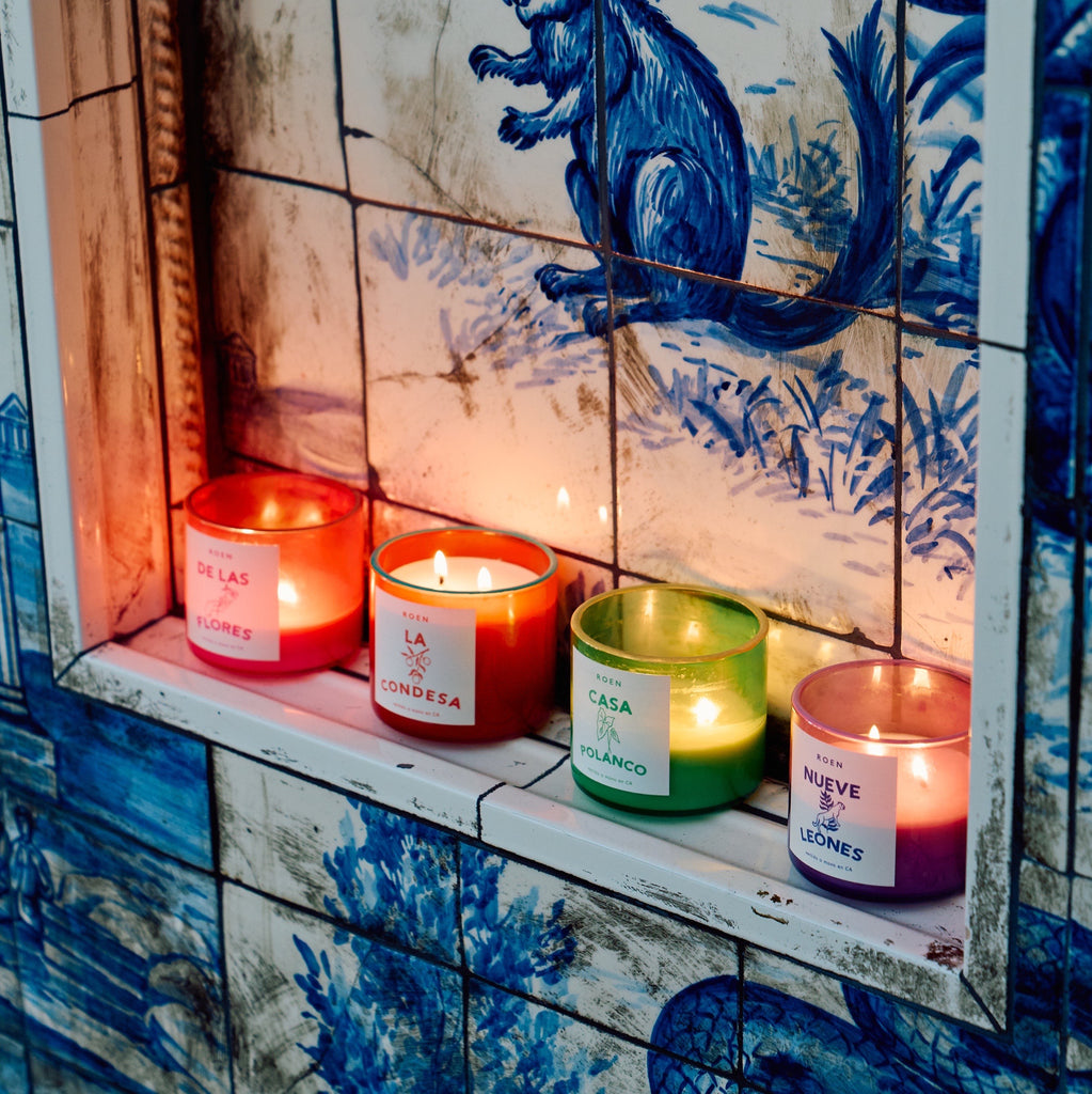 Colorful Roen candles with decorative tiles in the background